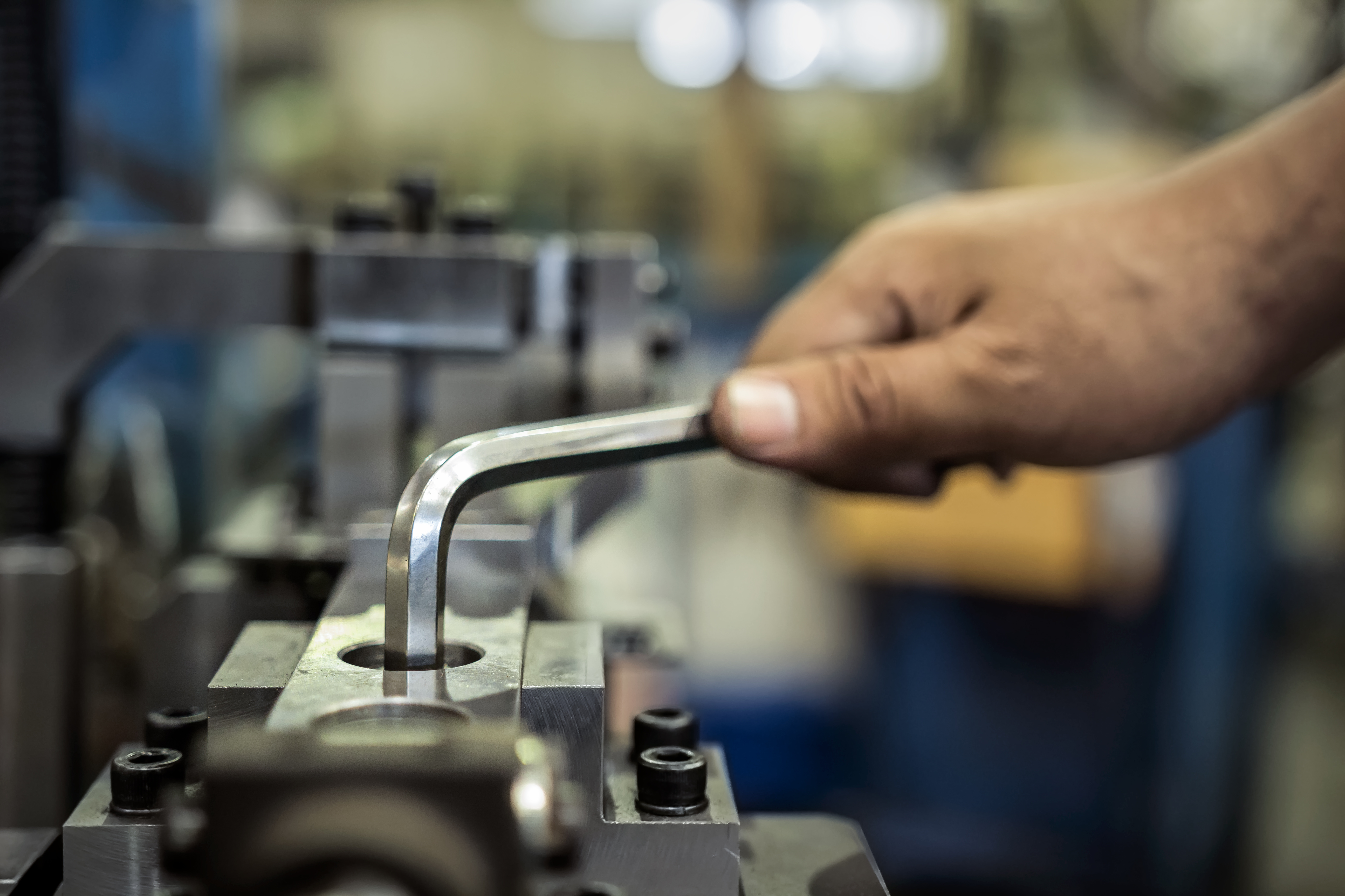 Worker is used Hexagonal screwdriver in factory