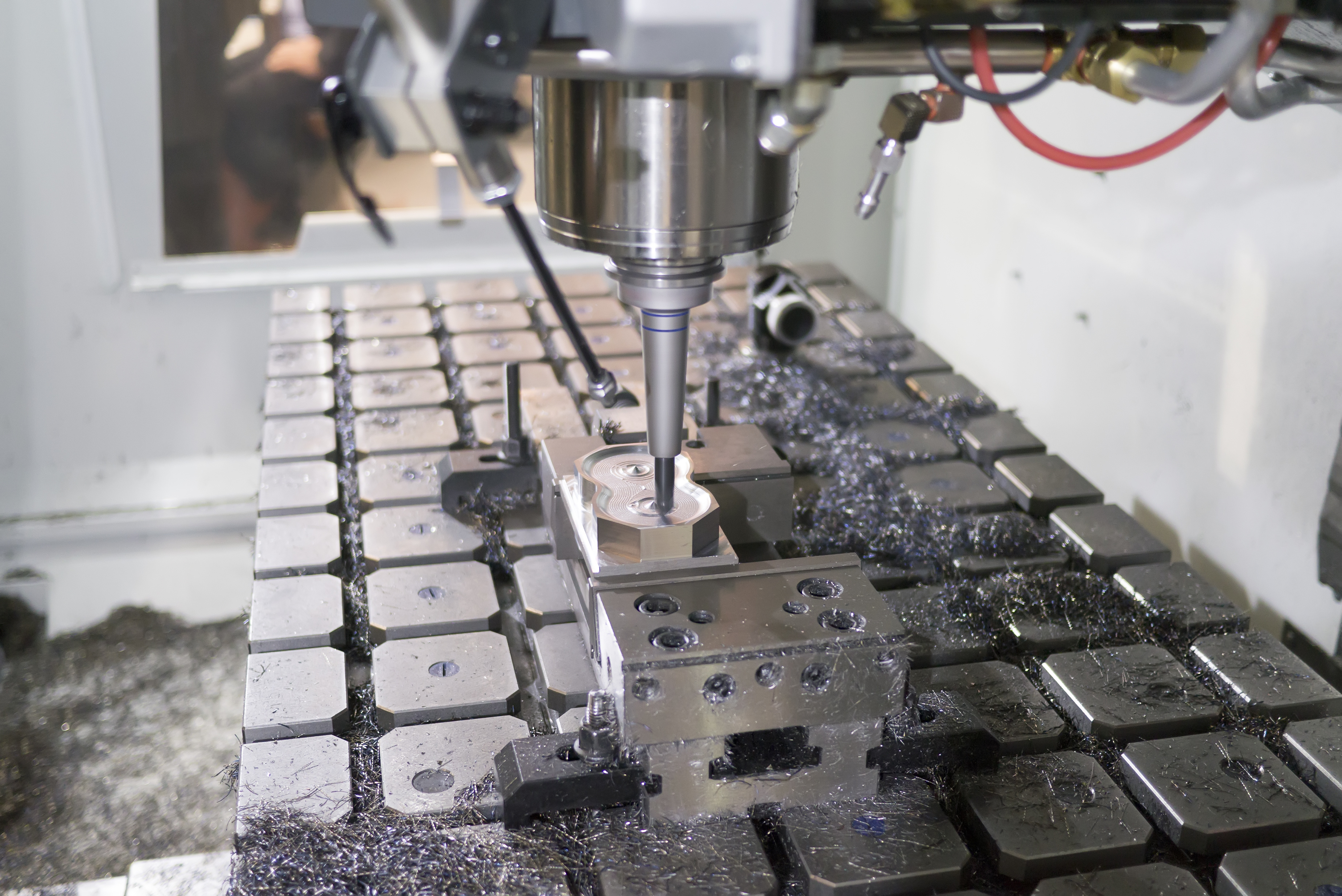 Workholding 101 Metalworking CNC milling machine. Cutting metal processing technology. Rotating blurred tool.