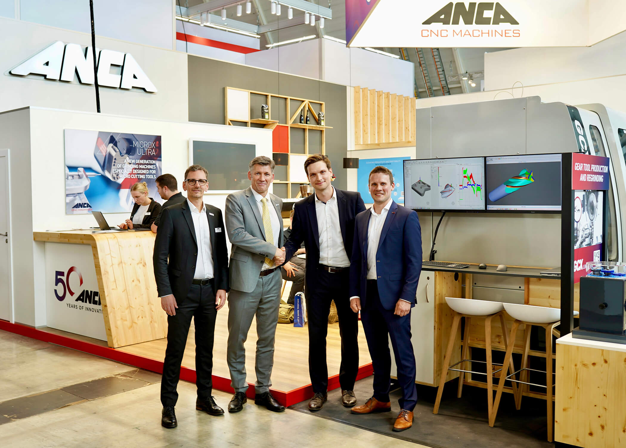 ANCA and Tetralytix Announce Strategic Partnership for Virtual Cutting Tool Design Steffen Kluth and Martin U. Ripple from ANCA in partnership with Dr.-Ing. Arne Mücke and Oliver Pape from Tetralytix at AMB_rt (1)